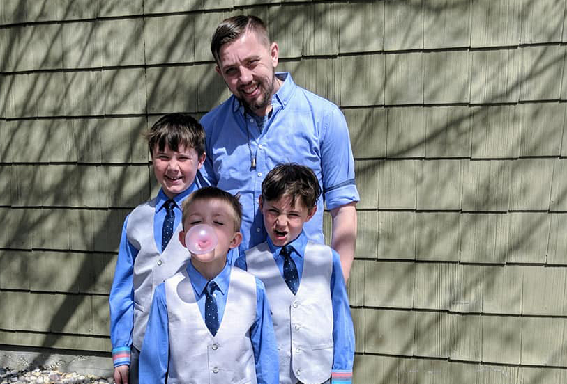 Photo of Sioux Falls coaching member Parker Stewart with his three sons