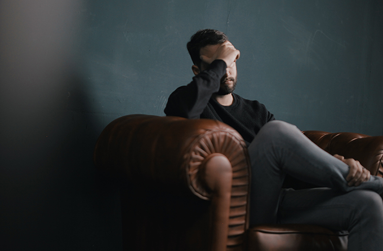 Photo of man on couch