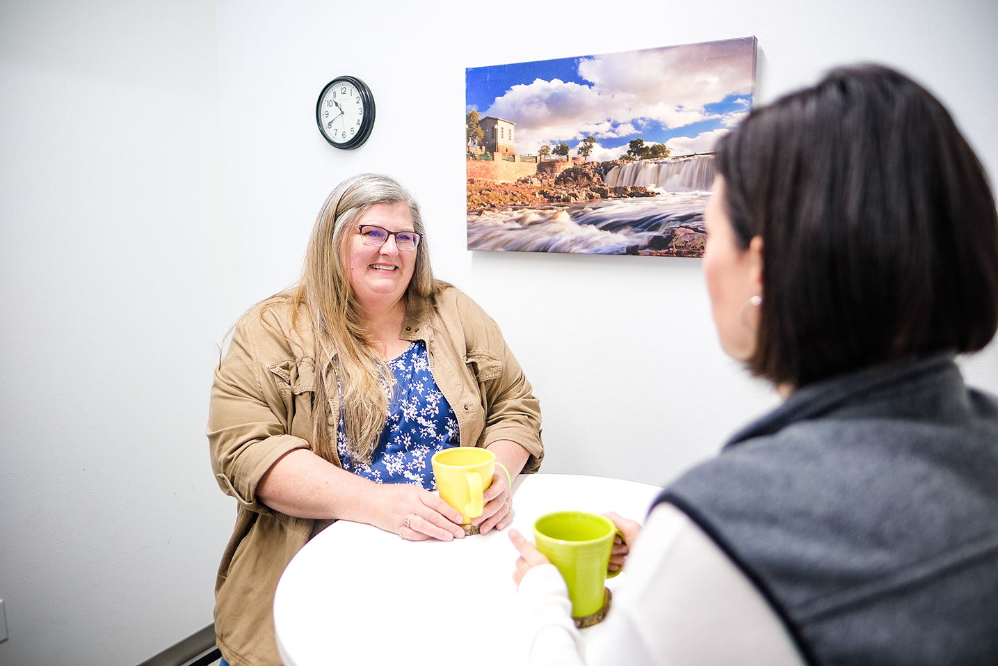 Photo of two women talking in coaching room