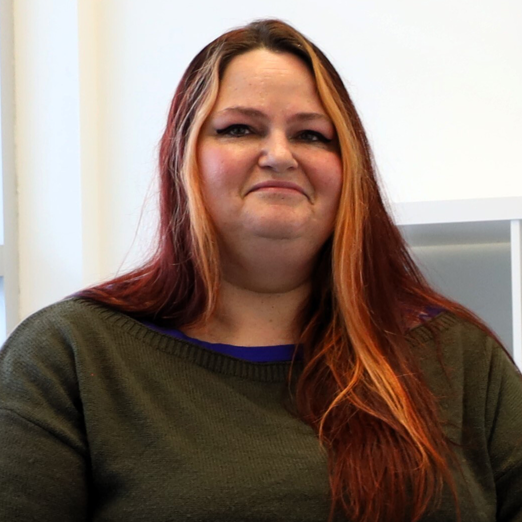 Photo of woman sitting in office