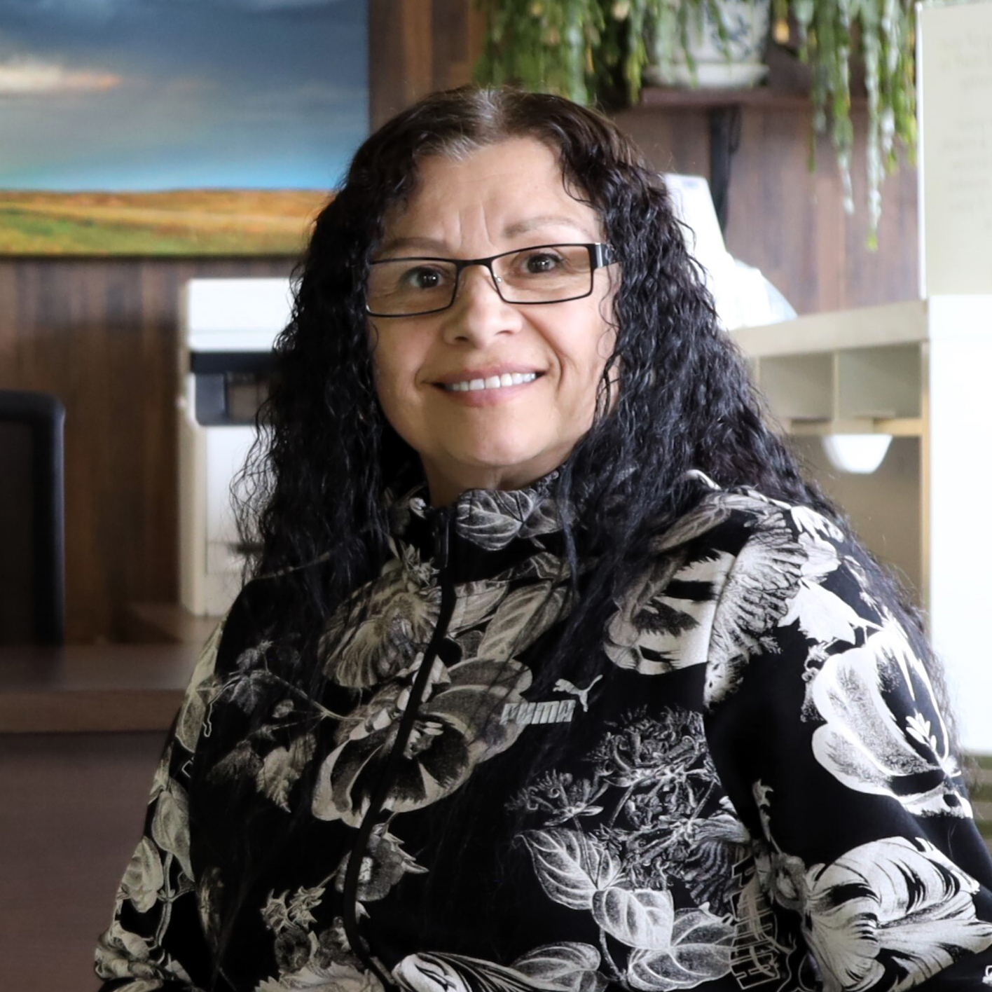 Photo of woman sitting in office