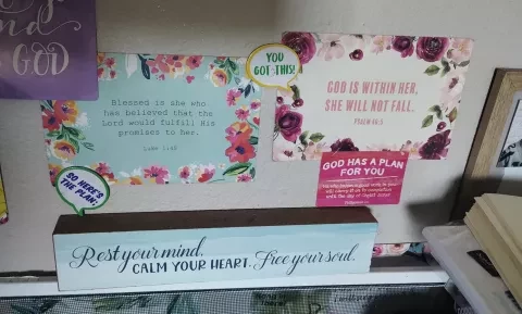 Photo of Marquita's wall with prayers and inspirational images