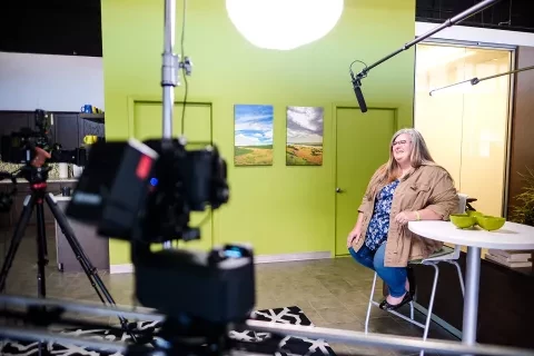 Photo of Kristen being interviewed in Sioux Falls office