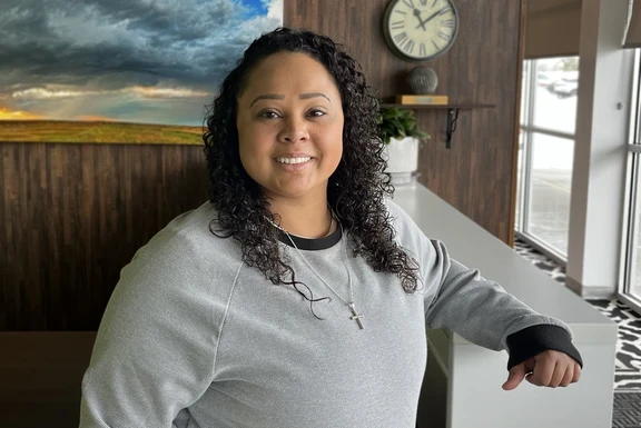 Photo of Shannon, woman in office