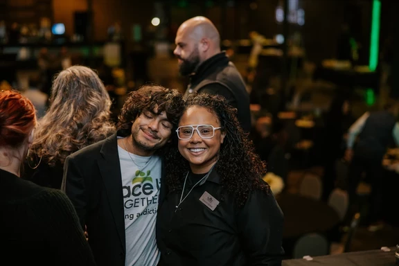 Photo of Carlos and Shannon smiling at Face It in the Fire